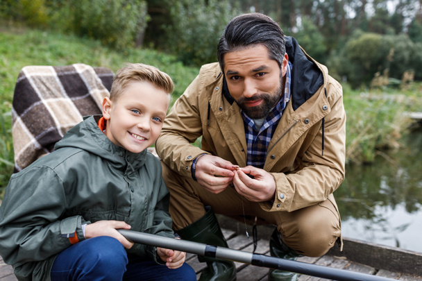 father and son fishing with rod - Photo, Image