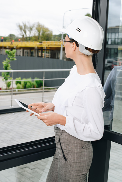 businesswoman in hardhat with digital tablet  - Photo, Image