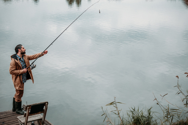 man fishing with rod  - Photo, Image