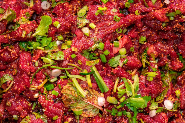 Raw spicy Thai minced beef salad, Northeast Thailand food culture. Cause of tapeworm - Photo, Image