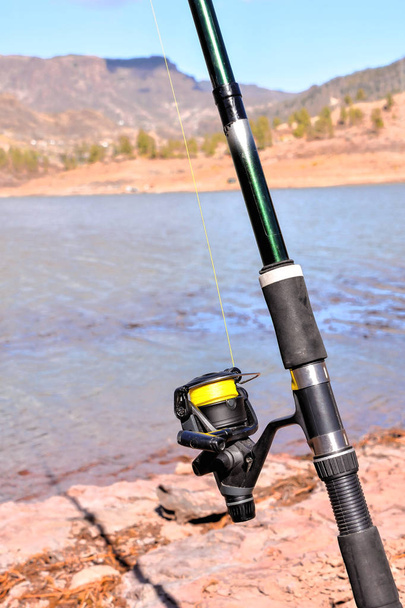 Fishing with rod on lake - Photo, Image