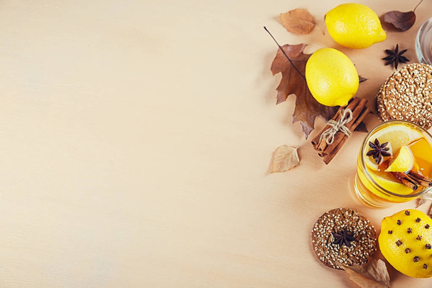 Autumn hot tea with lemon in glass cup. - Valokuva, kuva