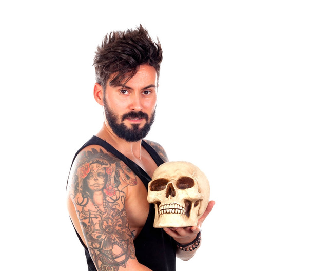 handsome bearded man with human skull - Photo, Image