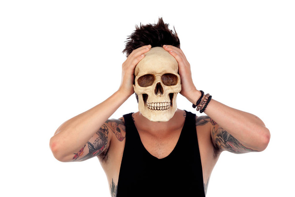 handsome man with human skull - Photo, Image
