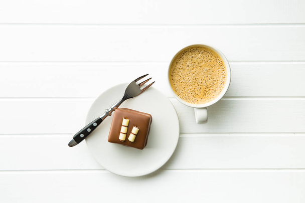 Sweet chocolate dessert  and coffee cup. - Foto, imagen