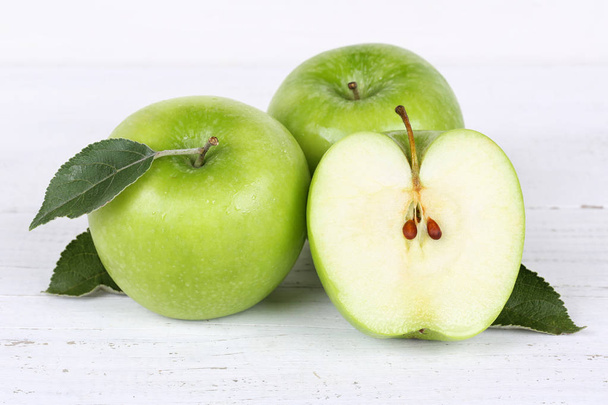 Apples apple slice fruit fruits green on wooden board - 写真・画像