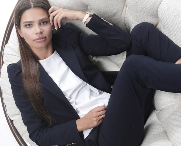 business woman thinking,sitting in a round chair - Foto, afbeelding