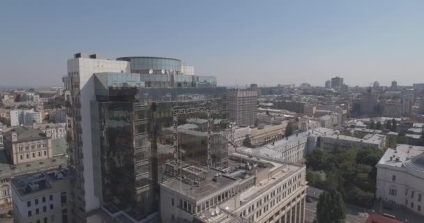 aerial survey. glass office building in the city of Kiev. August 13, 2017. urban landscape from a bird's eye view. Ancient knowledge with construction with a modern beautiful building. sunny morning - Materiał filmowy, wideo