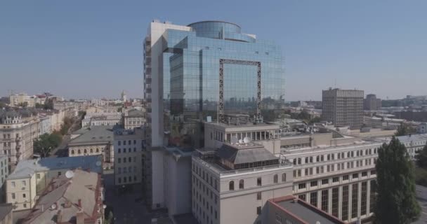 aerial survey. glass office building in the city of Kiev. August 13, 2017. urban landscape from a bird's eye view. Ancient knowledge with construction with a modern beautiful building. sunny morning - Imágenes, Vídeo