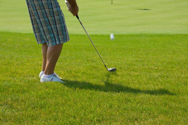Giocatore di golf su un green
 - Foto, immagini