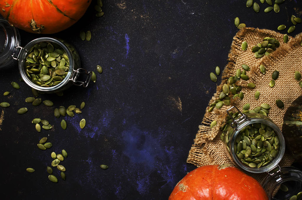 Raw pumpkin seeds in glass jar  - Zdjęcie, obraz