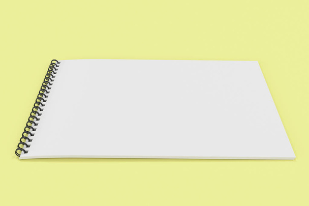 Blank white notebook with black spiral bound on yellow backgroun - Foto, immagini