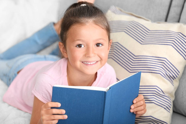 Cute little girl reading book  - Fotoğraf, Görsel