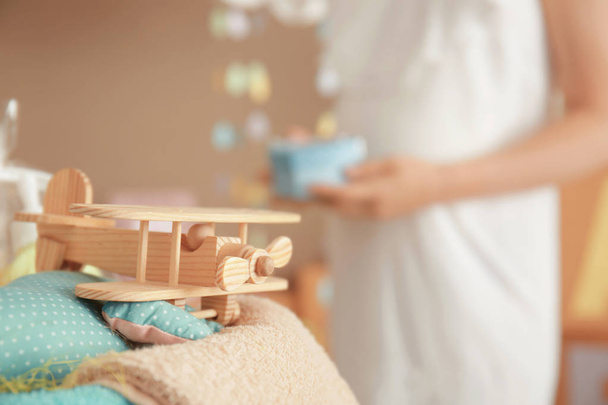 Toy and blurred pregnant woman - Фото, изображение