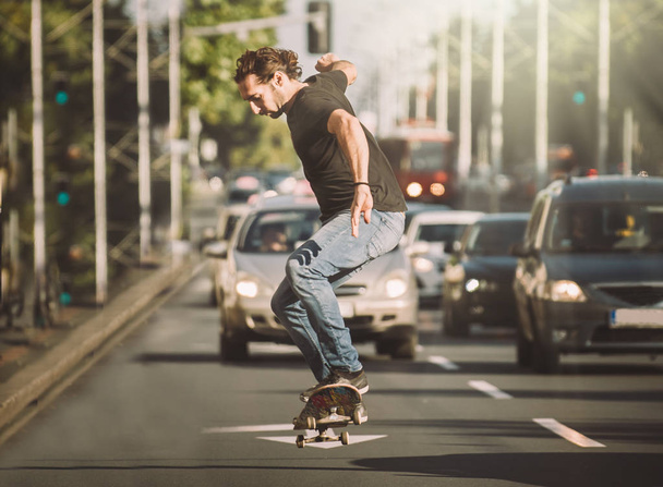 Pro skater doing tricks and jumps on street. Free ride - Foto, immagini