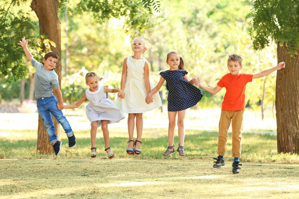 Group of children in park on sunny day - Foto, immagini
