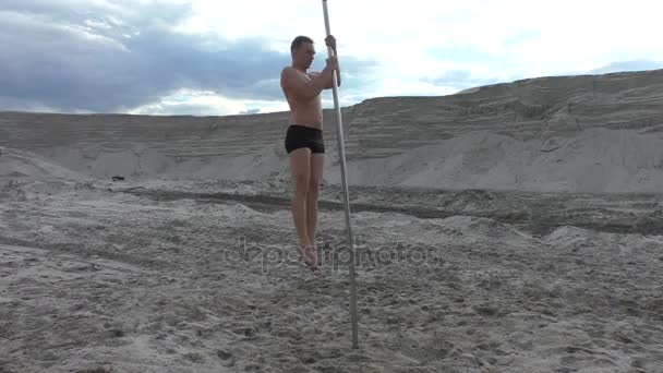 Man is spinning dancing on a pole. - Footage, Video