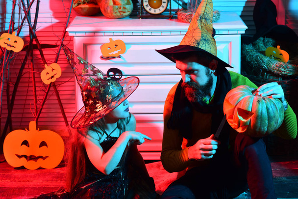 Father and daughter with Halloween decor. Wizard and little witch - Photo, Image