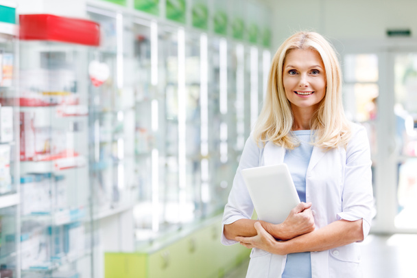 pharmacist with digital tablet in drugstore - Фото, изображение