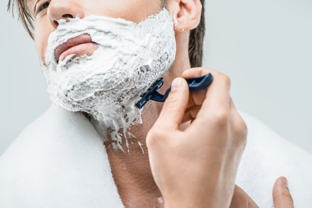 man in foam shaving with razor - Φωτογραφία, εικόνα