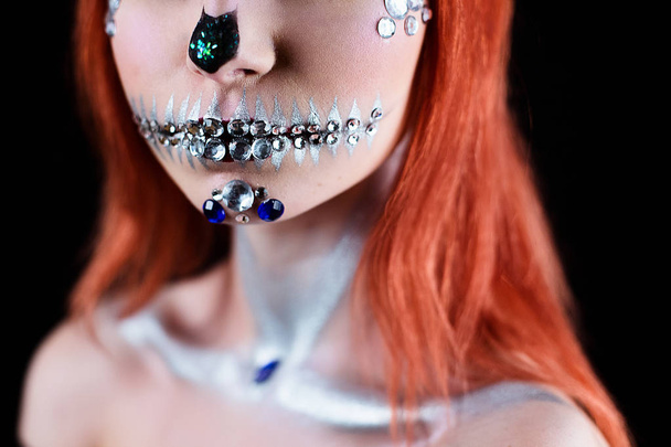 Fashion model with halloween skull makeup with glitter and rhinestones - Foto, imagen