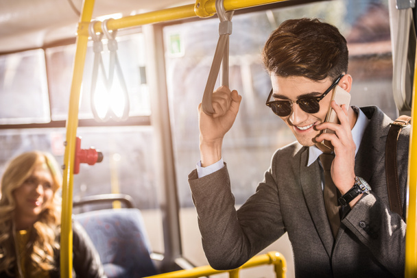 young businessman in bus - Photo, Image
