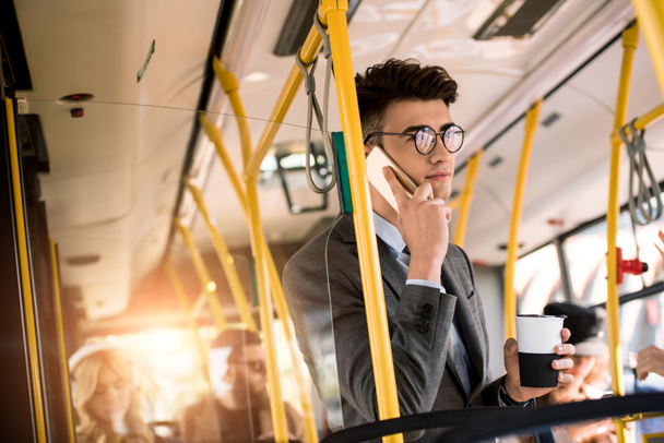 young businessman in bus - Photo, image
