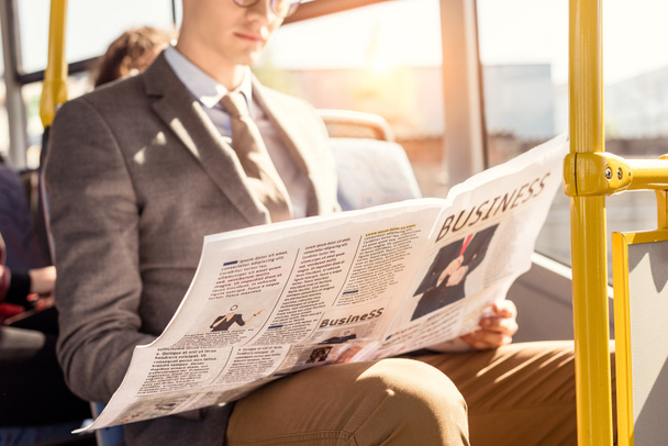 man with newspaper in bus - Zdjęcie, obraz