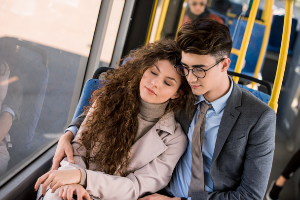 young couple in bus - 写真・画像