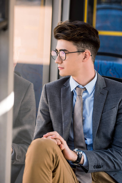 young businessman in bus - Foto, afbeelding