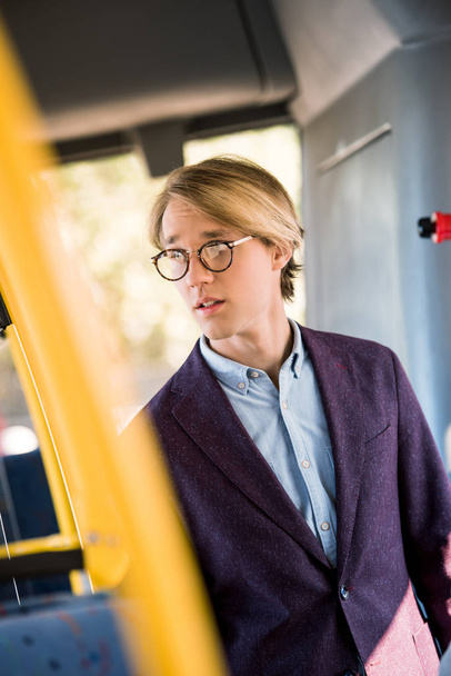 young man in eyeglasses in bus - Foto, Imagem