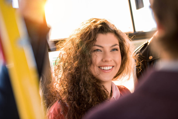 smiling girl in city bus - 写真・画像