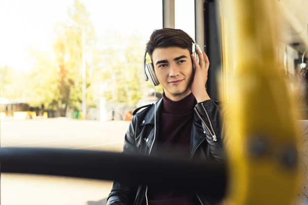 man listening music in bus - Фото, зображення