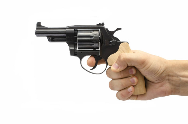 револьвер в руке изолирован на белом
 - Фото, изображение