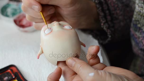 Master puppeteer draws eyes for dolls.  - Footage, Video