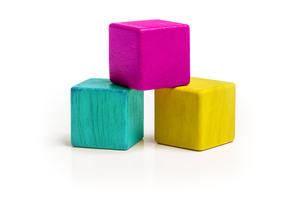 Toy Cube Blocks, CMYK Color Isolated over White Background, Three Wood Toys - Photo, Image