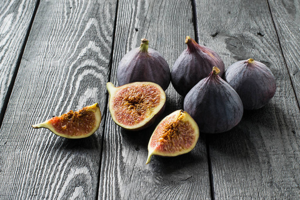 Ripe fresh figs on dark wooden background  - Photo, Image