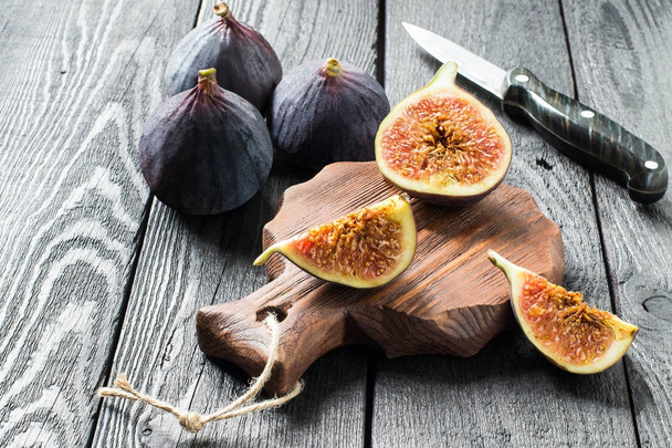 Ripe fresh figs on dark wooden background  - Photo, Image