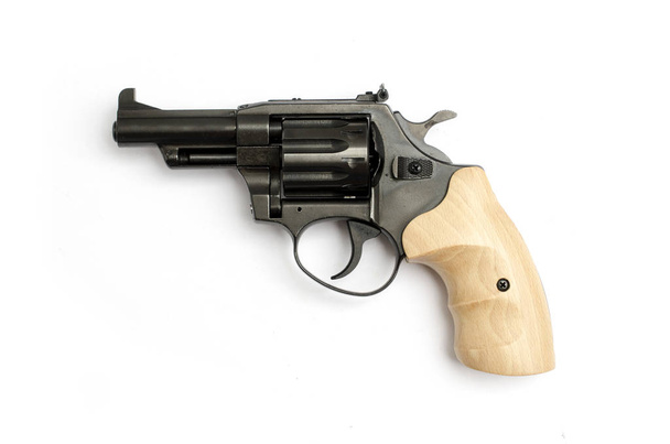 revolver with a wooden handle isolated on a white background - Photo, Image