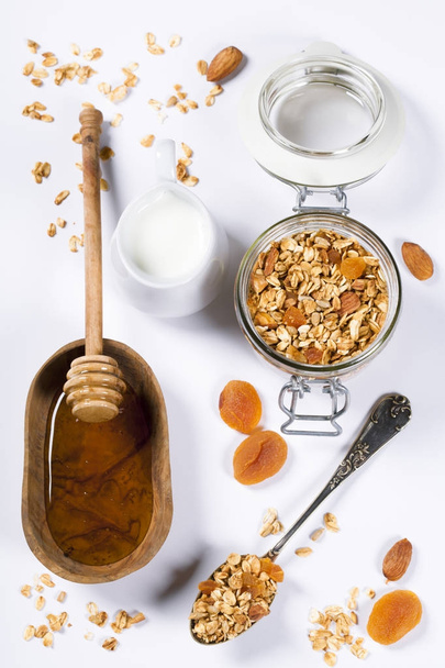 Healthy breakfast -  Homemade granola, honey and milk - Photo, Image