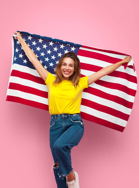 Cheerful girl posing with flag - Zdjęcie, obraz