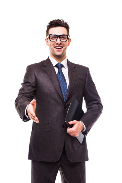 Portrait of young successful business man offering handshake on white - 写真・画像