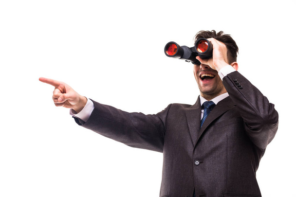 Binocular businessman pointing and smiling isolated on white background - Photo, Image