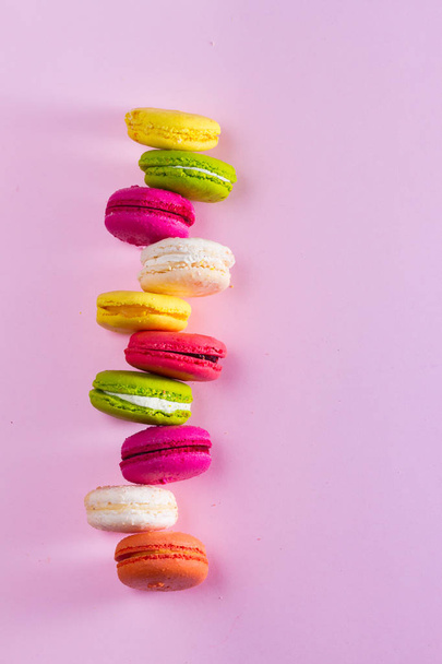 Macaroons cookies on pink - Фото, изображение
