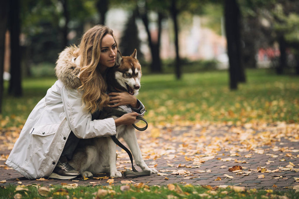 Woman with dog - Фото, изображение