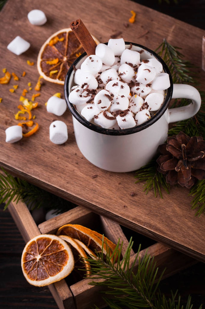Cup of hot chocolate with marshmallows on a wooden table - Foto, imagen