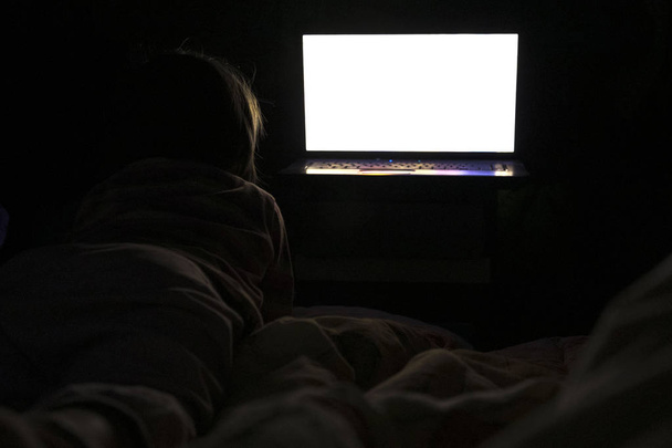 Children looking at laptop with cartoons showing before sleeping - Foto, imagen