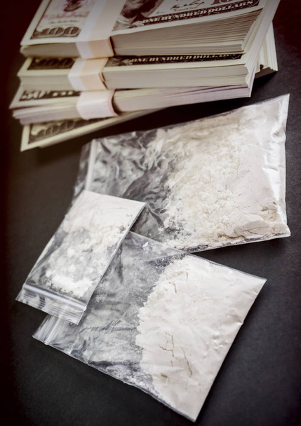 Drug bag along with some dollar bills, conceptual image - Photo, Image