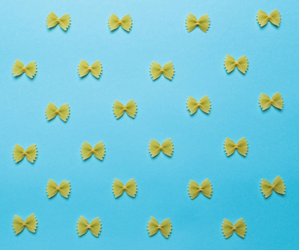 farfalle raw laid out in a texture - Photo, image