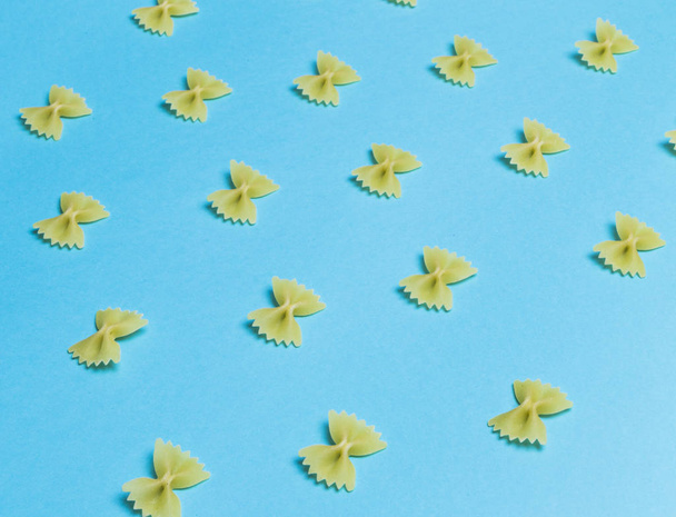 farfalle raw laid out in a texture - 写真・画像